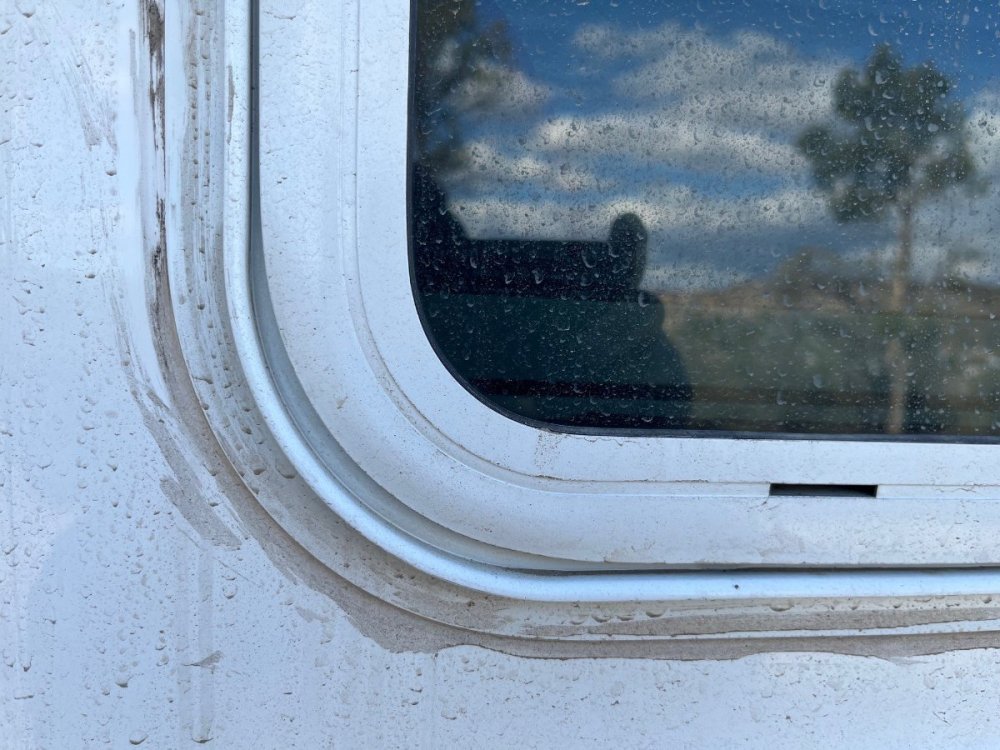 Window Caulk Mess.jpg